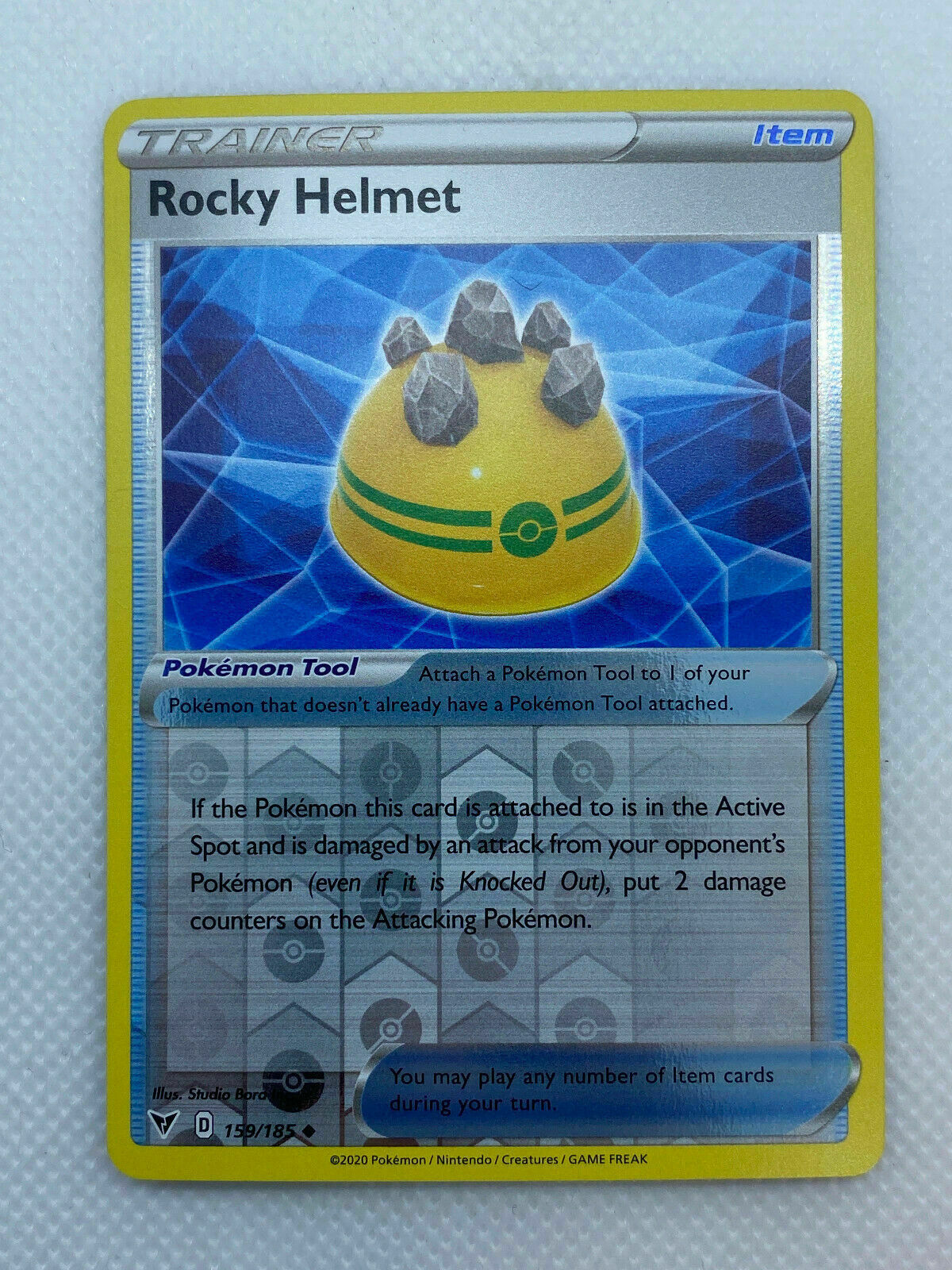 Pokémon Sword & Shield Vivid Voltage Trainer Reverse HOLO Rocky Helmet Uncommon