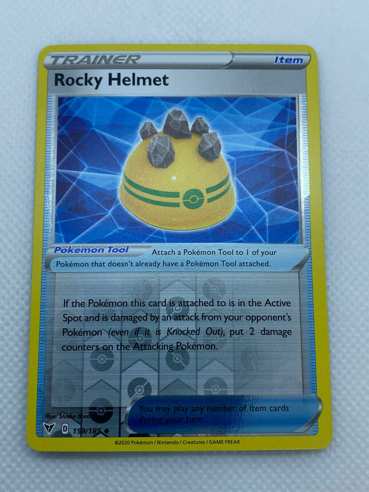 Pokémon Sword & Shield Vivid Voltage Trainer Reverse HOLO Rocky Helmet Uncommon